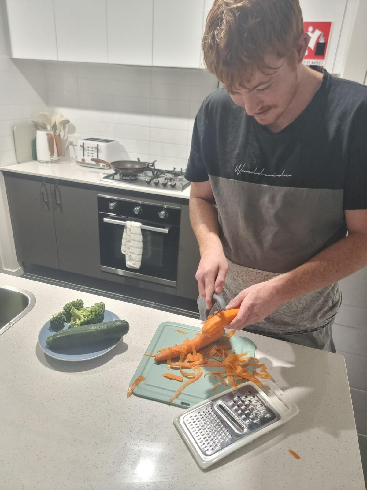 A participant preparing a meal from scratch in the kitchen of one of the Sanctuary homes.