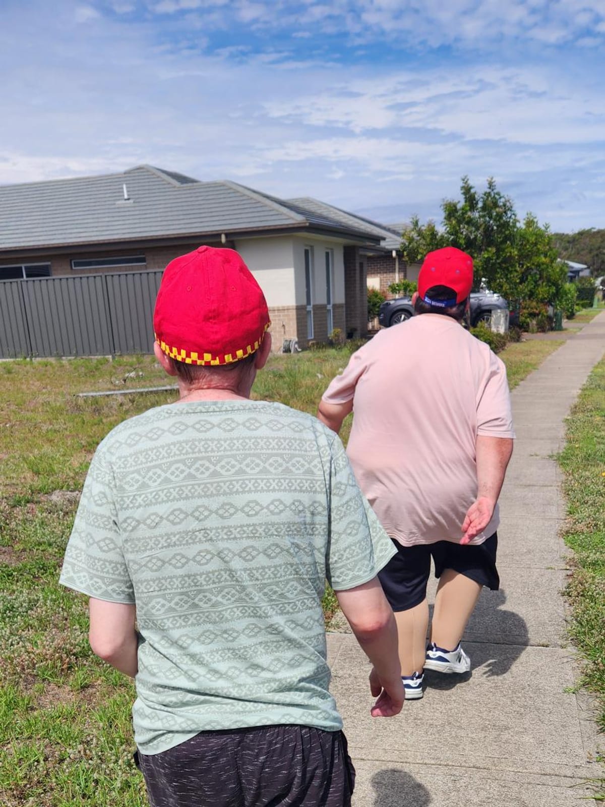 Two participants out for a walk together near one of the Sanctuary homes.